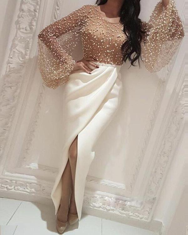 Women's long-sleeved blouse with sparkling pearl details and a figure-hugging cut, size [size missing]