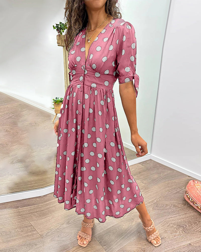 Dress with a deep V-neck and polka dots