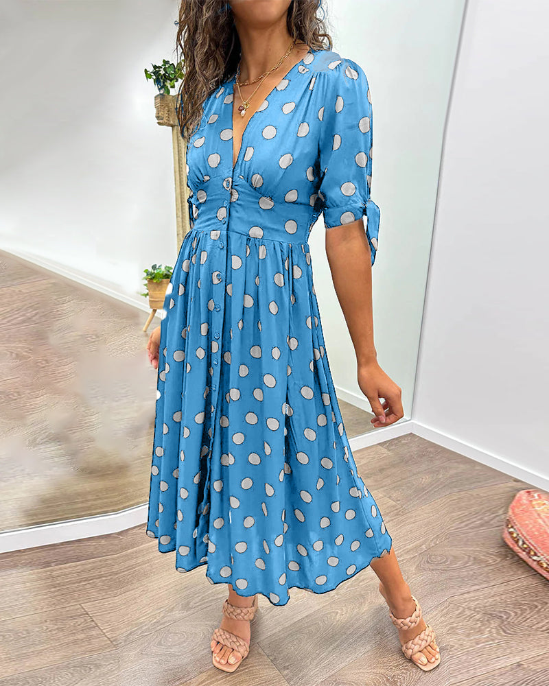 Dress with a deep V-neck and polka dots