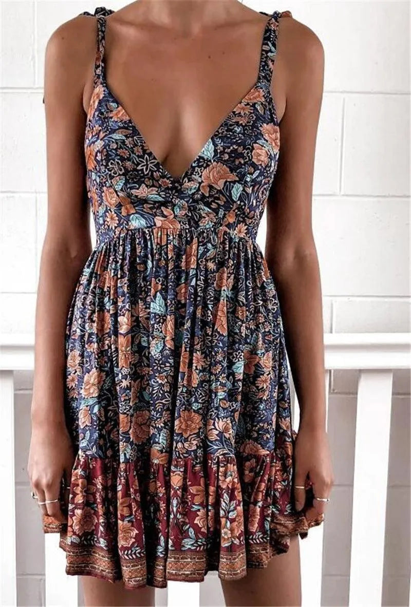 Valenzora | Printed dress with a deep neckline and shoulder straps for women