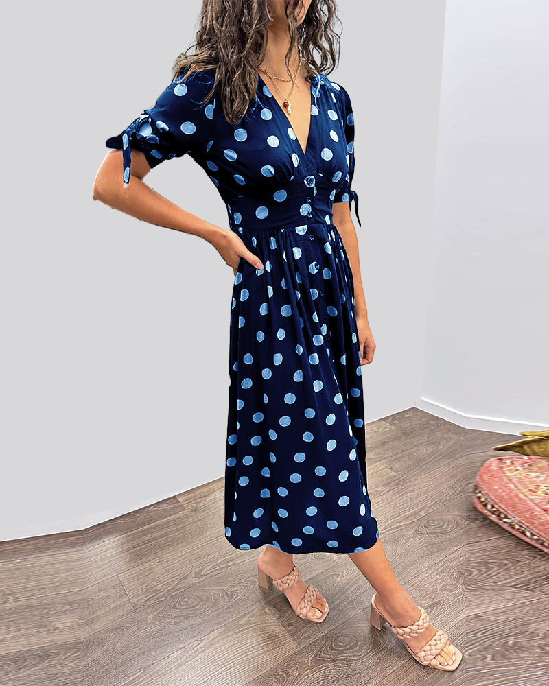 Dress with a deep V-neck and polka dots