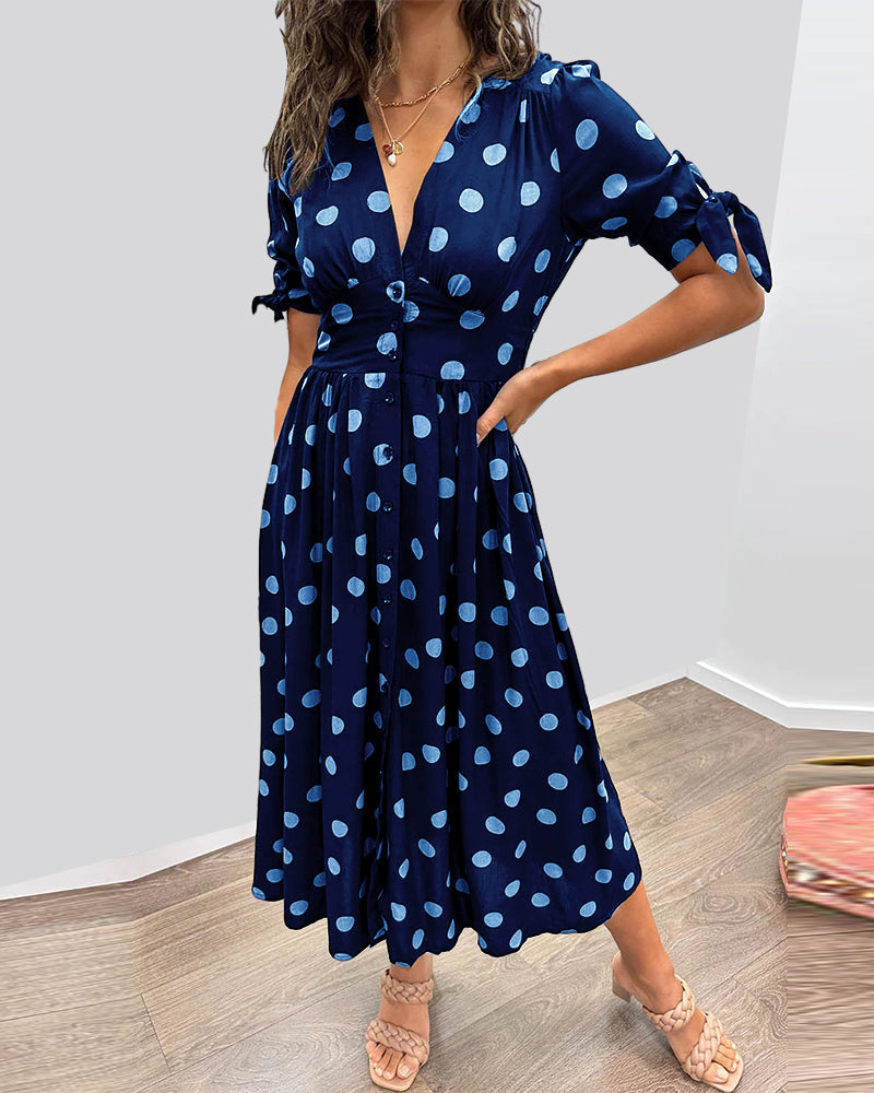 Dress with a deep V-neck and polka dots