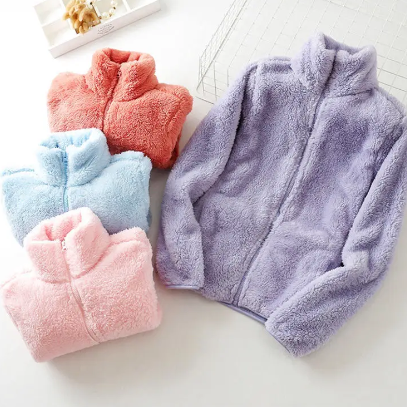 and a fluffy jacket with a zipper, fleece vest