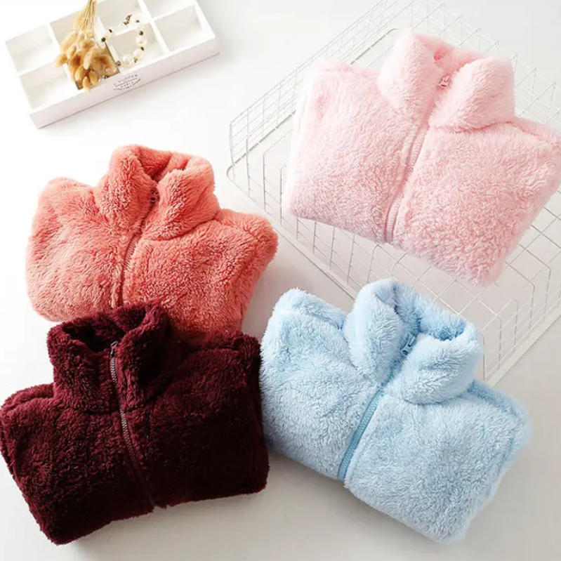and a fluffy jacket with a zipper, fleece vest