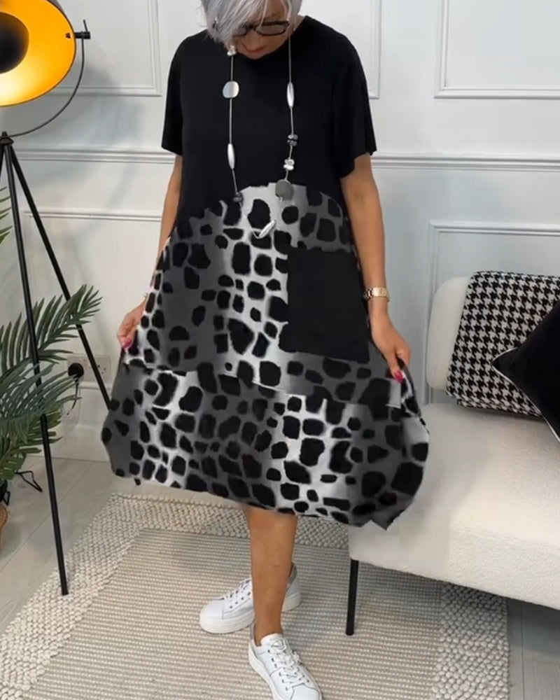 Valenzora | Short-sleeved, printed dress with a round neckline