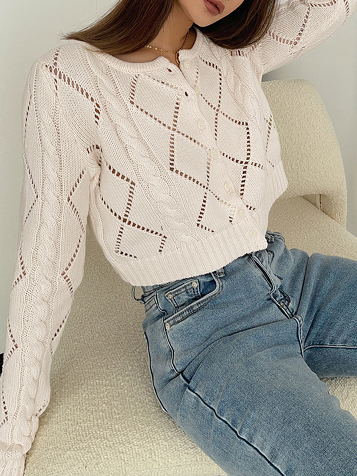 Knitted top with eyelet buttons