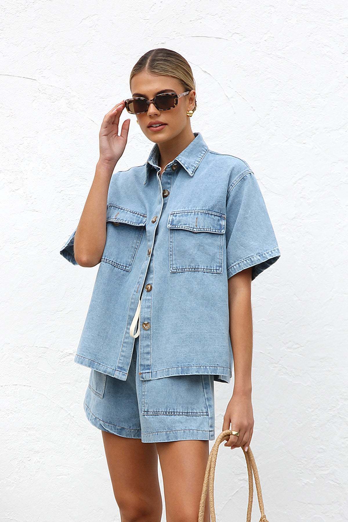 Women's denim crop top and shorts set with practical pockets and a relaxed fit, size S