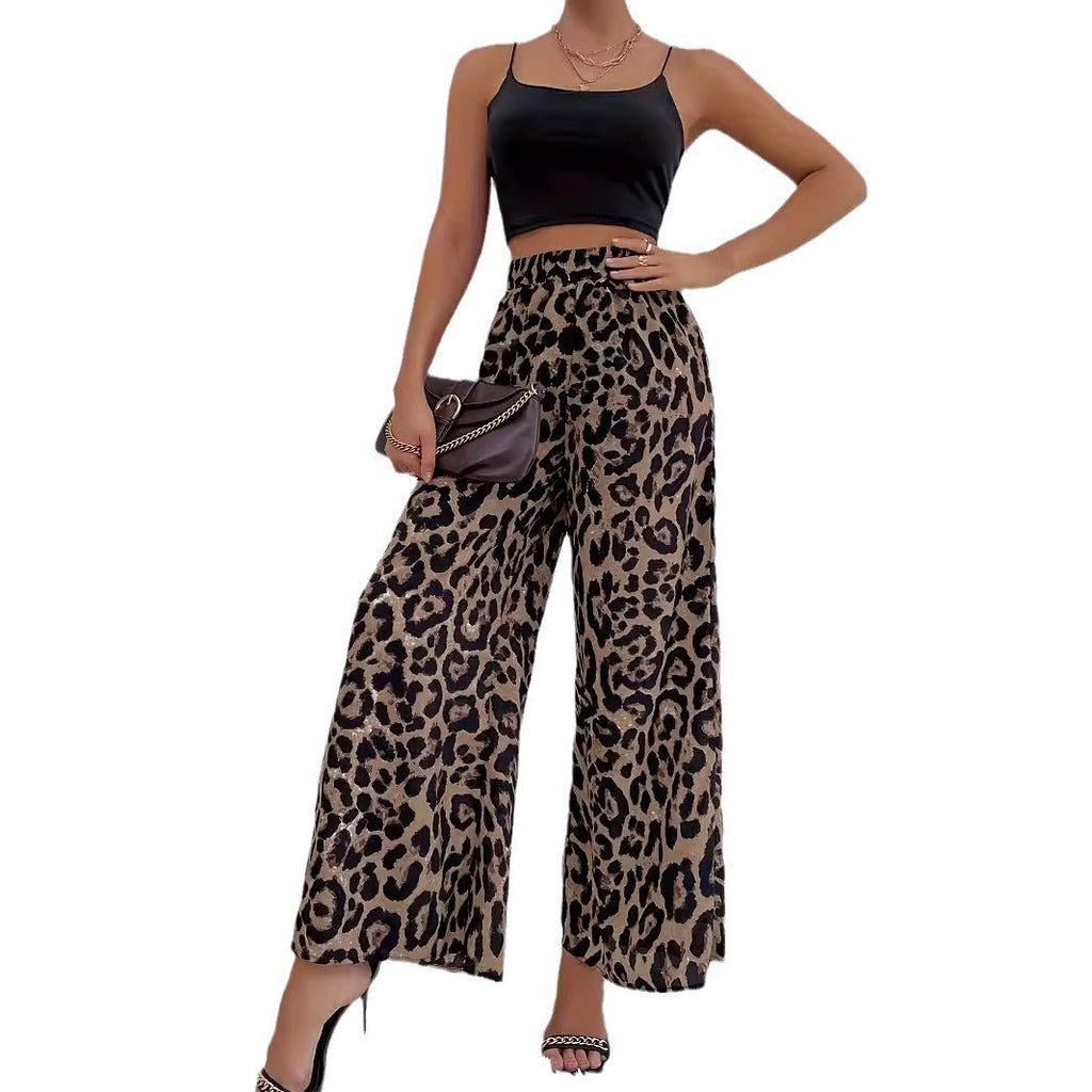 Women's wide-leg leopard print trousers in flowing material with elasticated waistband, size S