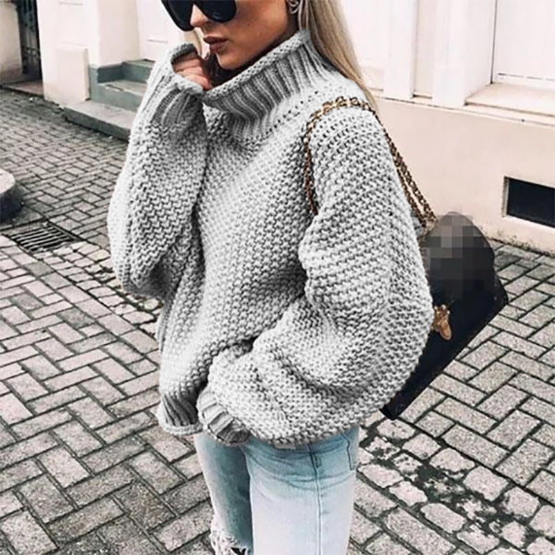 Women's chunky knit sweater with high collar and relaxed fit, size
