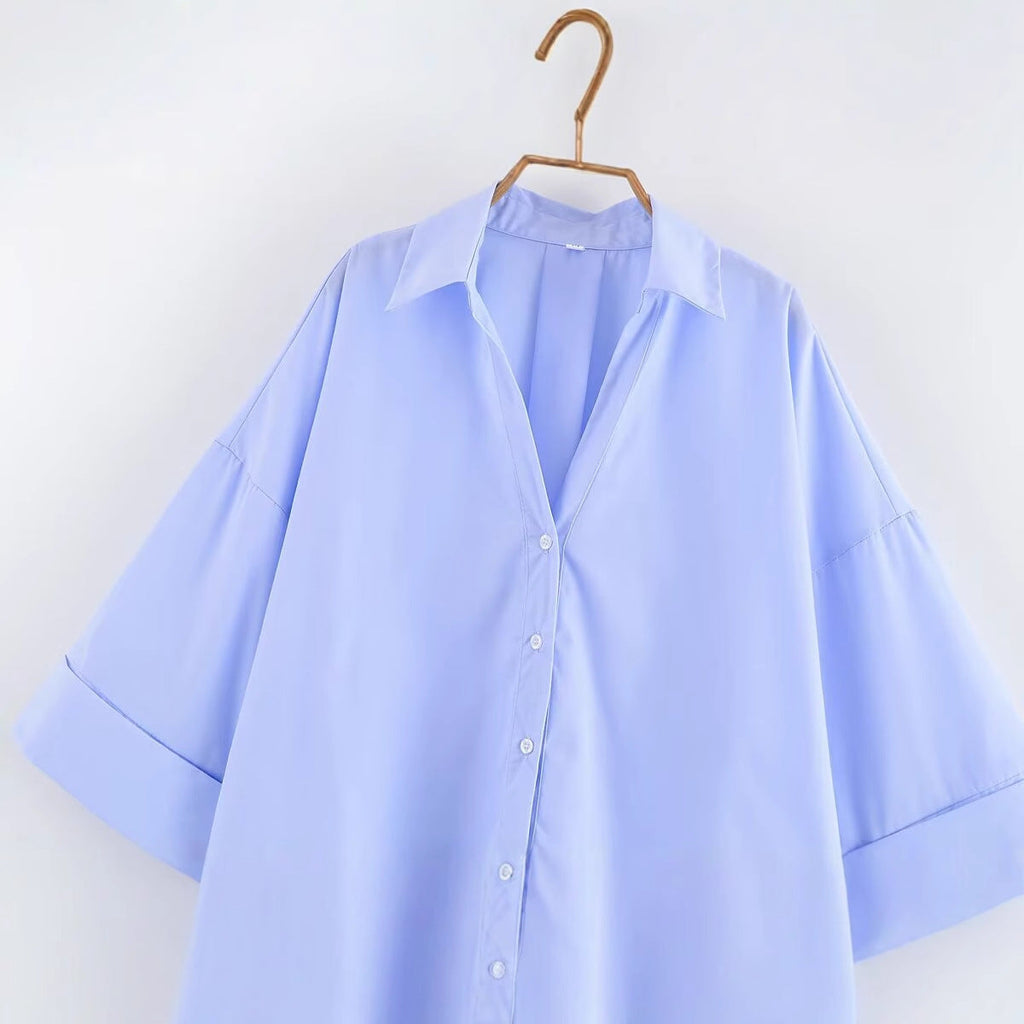 Women's blouse with oversized cut and chic lapel, size