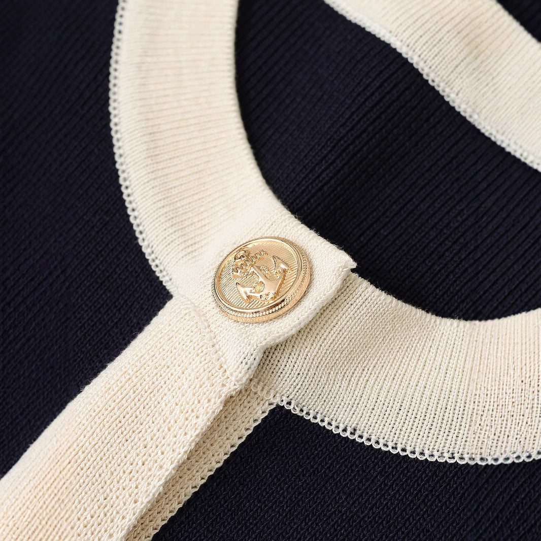 Women's short-sleeved knit top with decorative buttons and modern design, size S