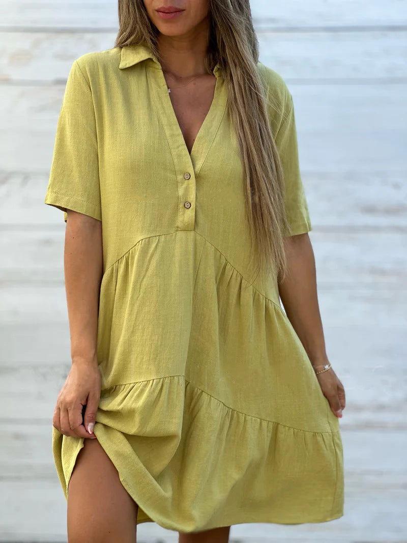 Women's loose-fitting shirt dress with button details and flowing hem, size
