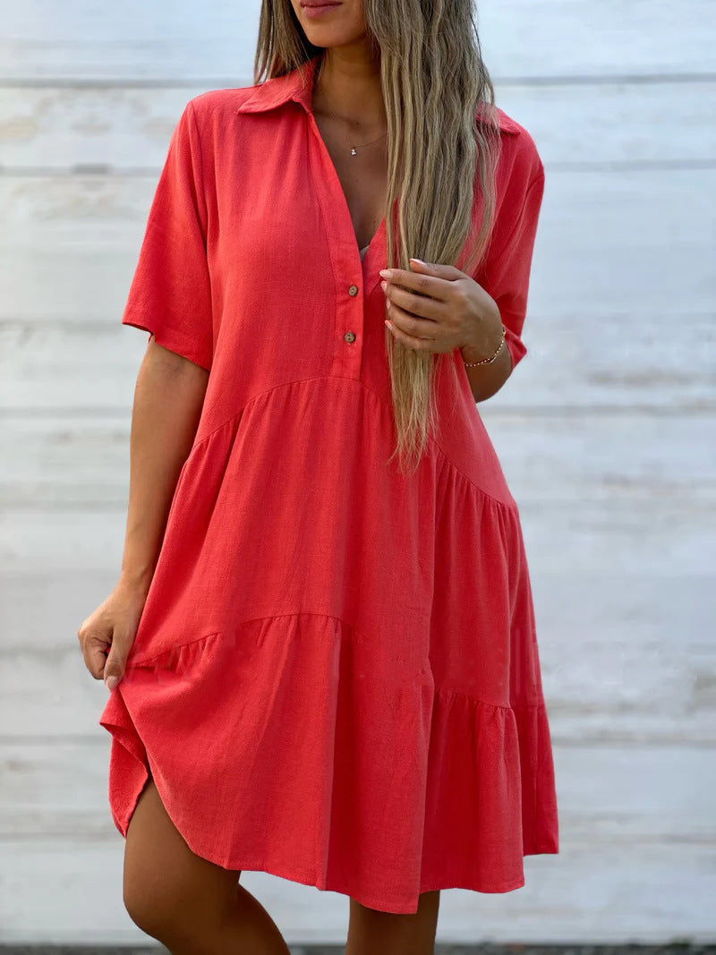 Women's loose-fitting shirt dress with button details and flowing hem, size