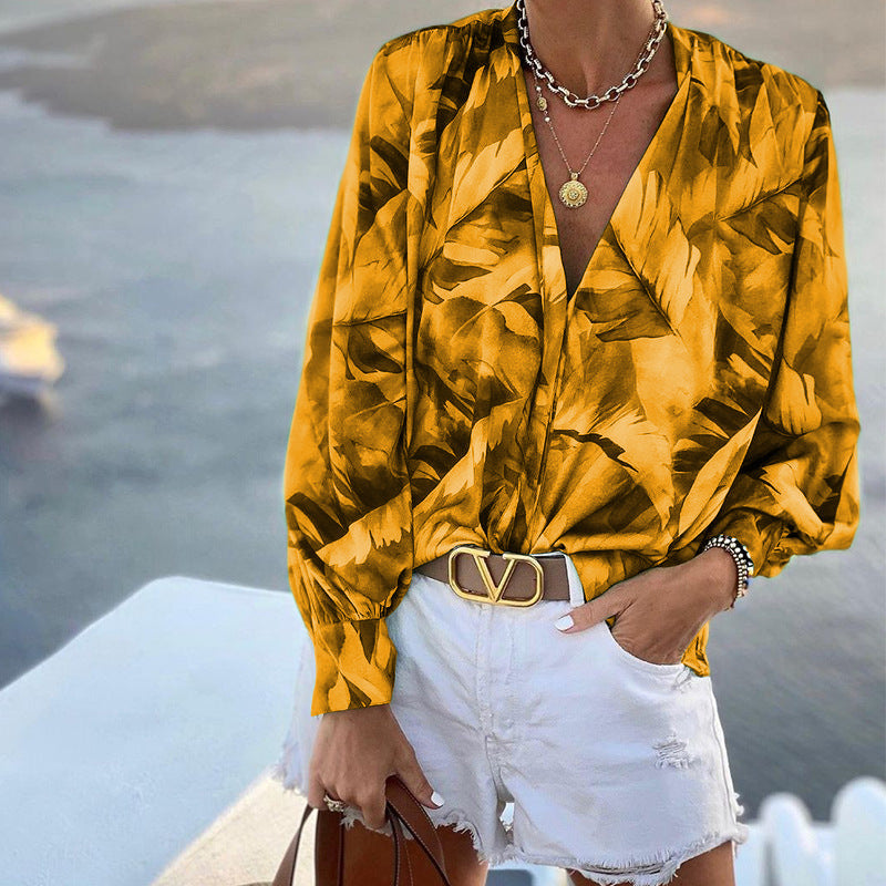 Women's blouse with floral pattern and deep V-neck, size