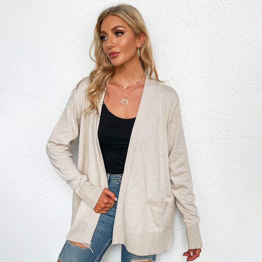 Women's casual knit cardigan with deep V-neck and practical pockets, size S