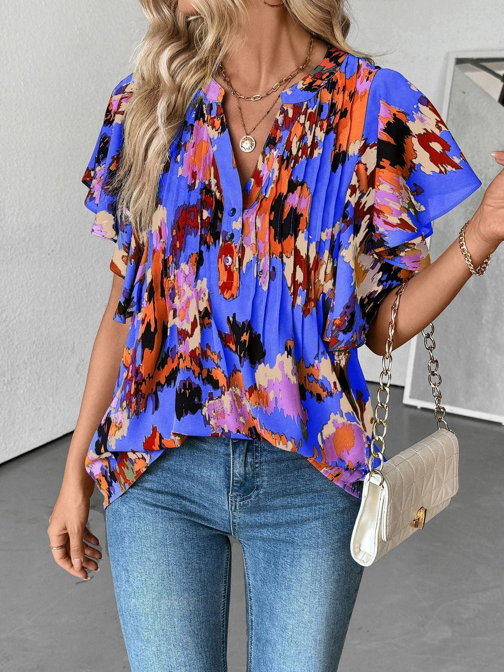 Damenbluse mit eleganten Rüschendetails und verspieltem Print, Größe S