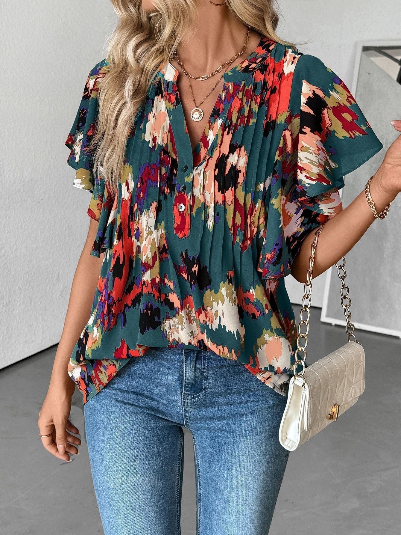 Damenbluse mit eleganten Rüschendetails und verspieltem Print, Größe S