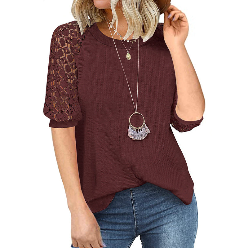 Women's top with lace sleeves and textured fabric, size