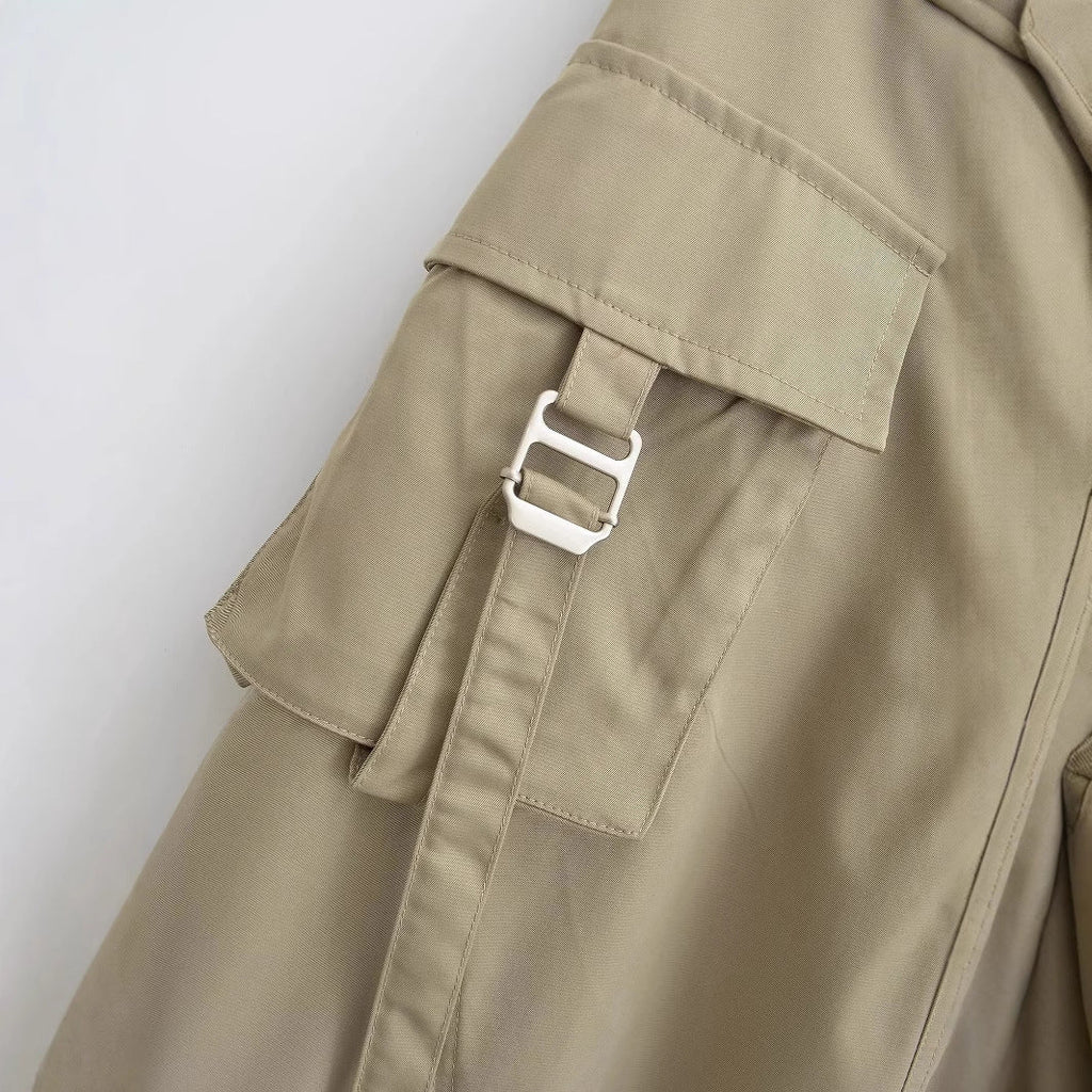 Women's midi skirt with practical cargo pockets and elegant cut, size S