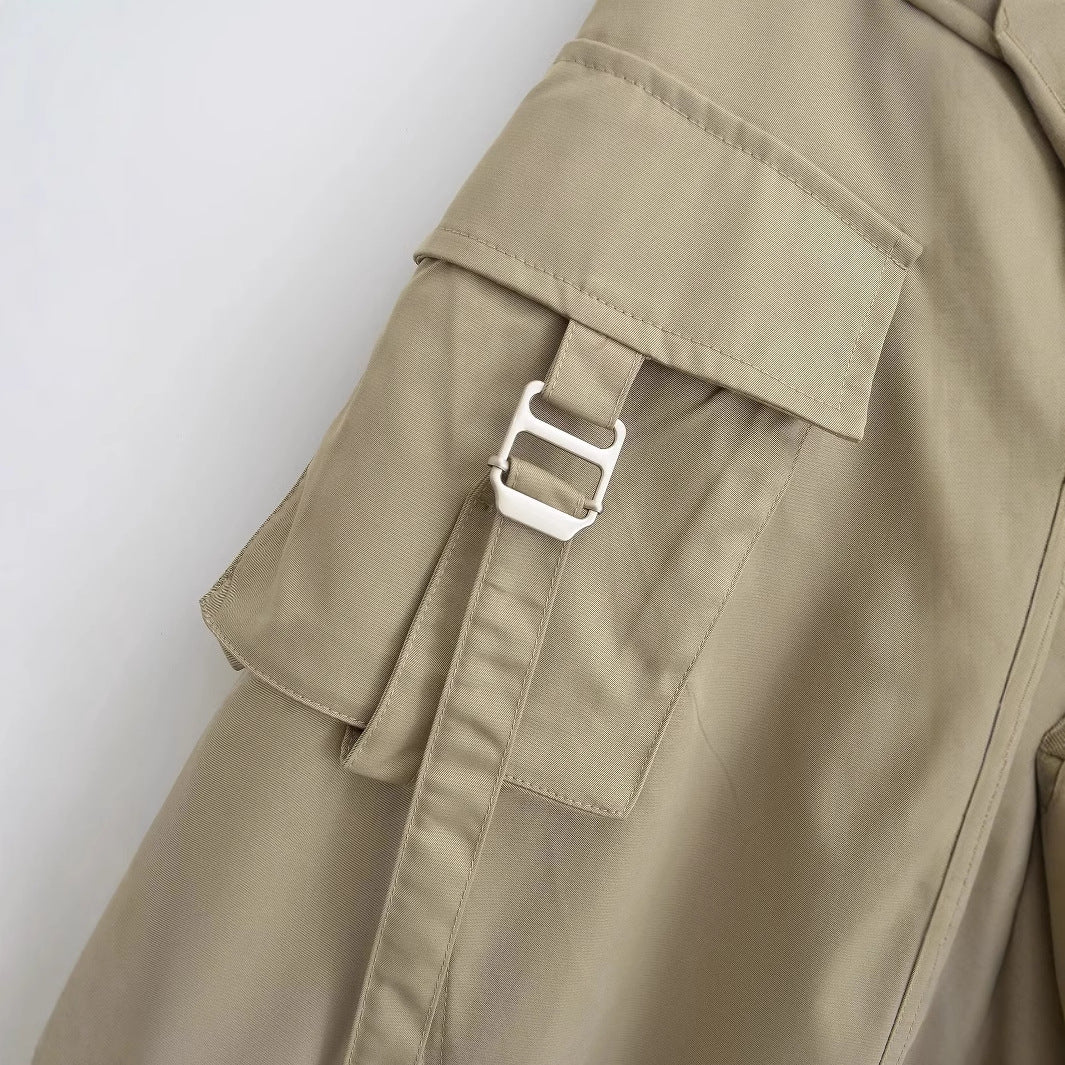 Women's midi skirt with practical cargo pockets and elegant cut, size S