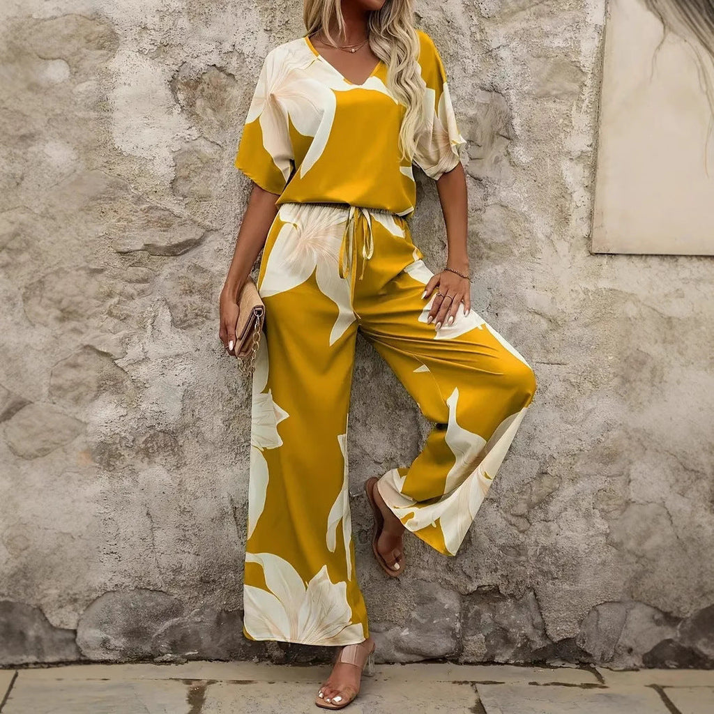 Women's relaxed jumpsuit with floral design and elasticated waistband, size