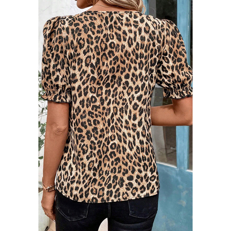 Women's blouse with fashionable leopard print and playful ruffle details, size [size missing]