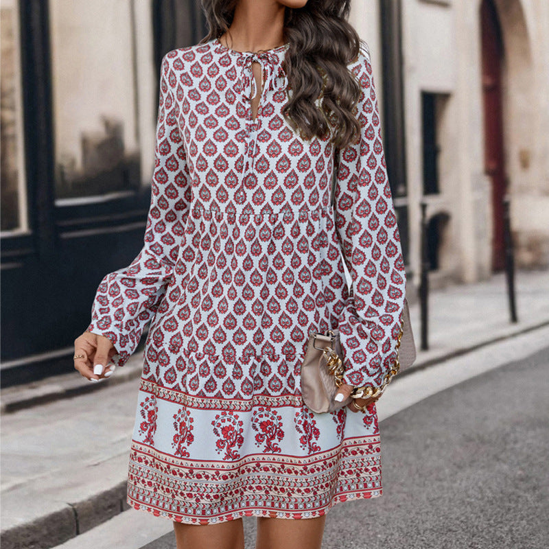 Women's boho-inspired mini dress with floral pattern and ruffle details, size S