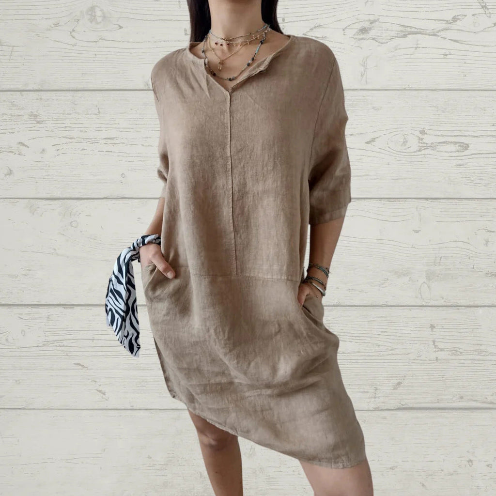 Women's lightweight linen dress with front button detail and side pockets, size