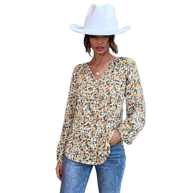 Women's blouse with floral design and elegant puff sleeves, size