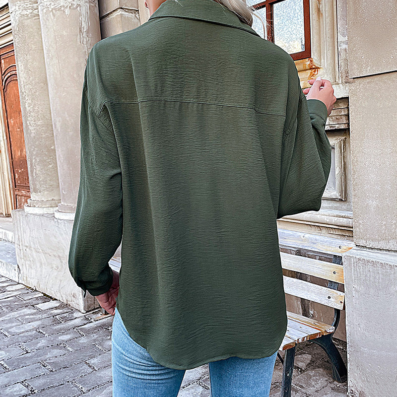 Women's blouse with a relaxed fit and decorative button details, size [size missing]