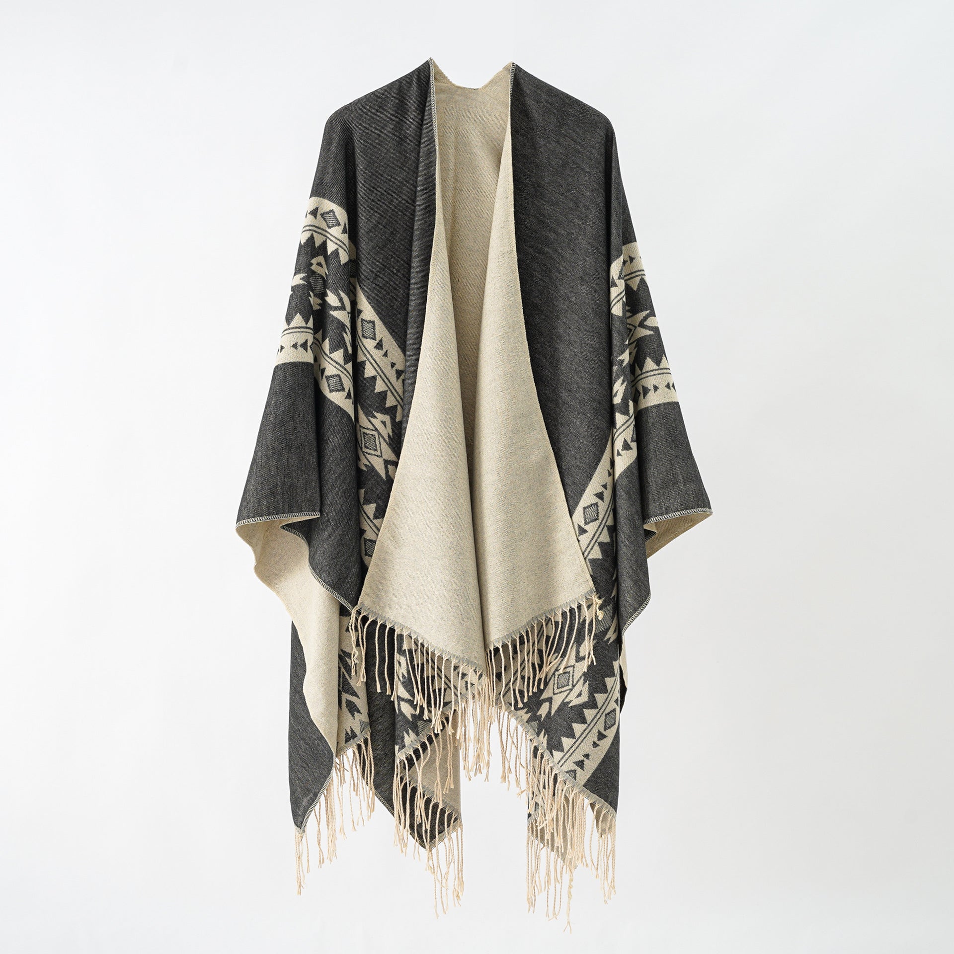 Women's elegant knitted poncho with artistic fringe and floral accents Valenzora