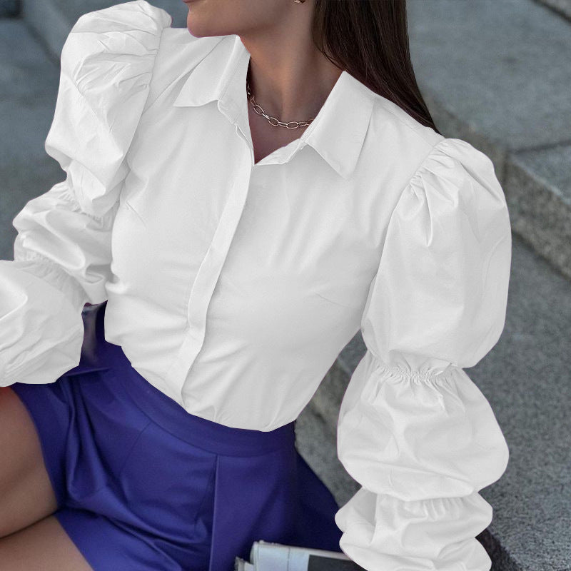 Women's blouse with voluminous puff sleeves and elegant cut, size S