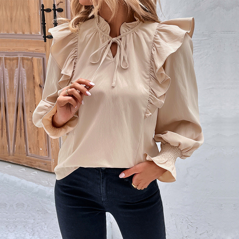 Women's blouse with elegant ruffle details and playful drawstring, size