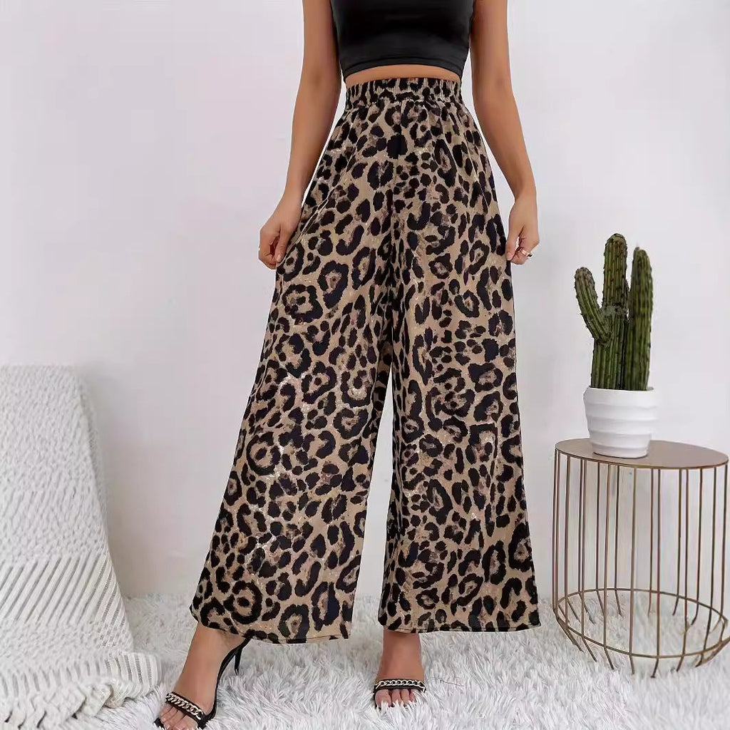 Women's wide-leg leopard print trousers in flowing material with elasticated waistband, size S