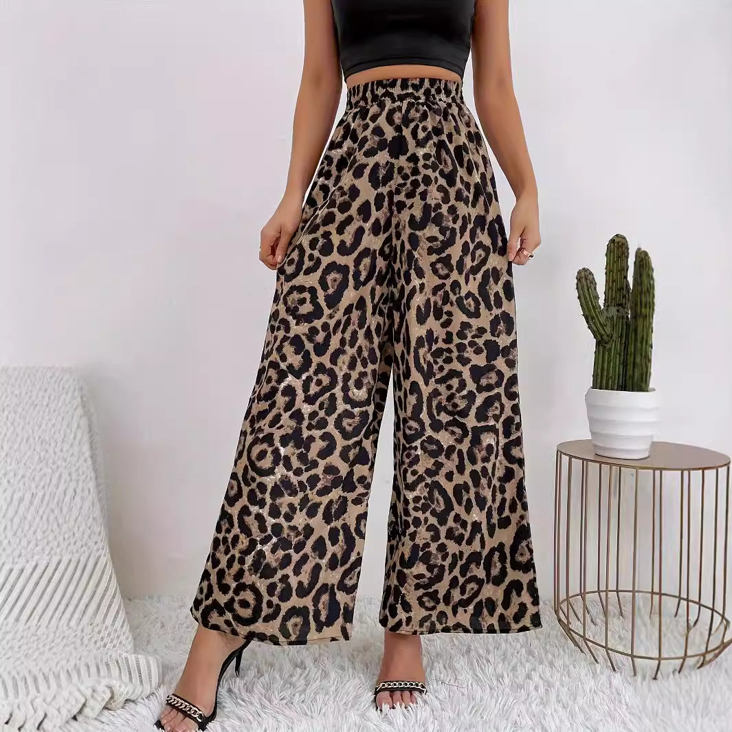 Women's wide-leg leopard print trousers in flowing material with elasticated waistband, size S