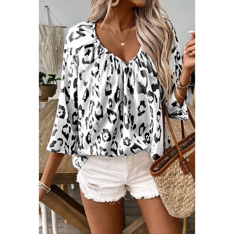Women's blouse top with a relaxed fit and chic leopard print, size S