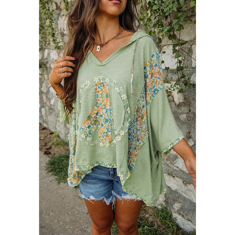 Women's casual hooded top with floral peace design, size S