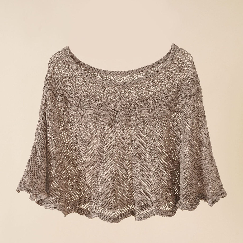 Women's airy knitted poncho in a modern design, size
