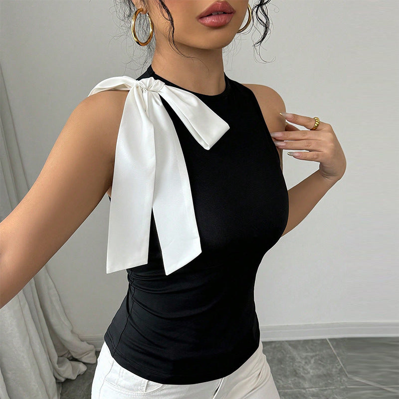 Women's sleeveless top with elegant bow appliqué, size