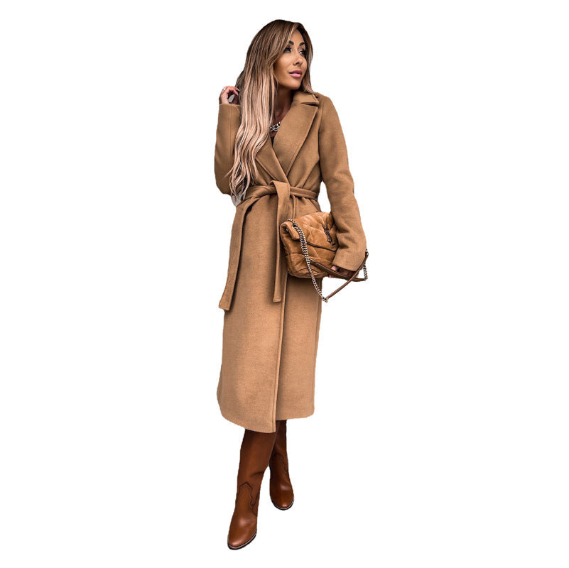 Women's elegant wool coat with tailored cut and belt, size S