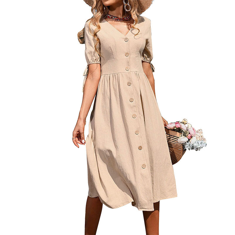 Women's midi dress with a tailored cut and modern button details, size [size]