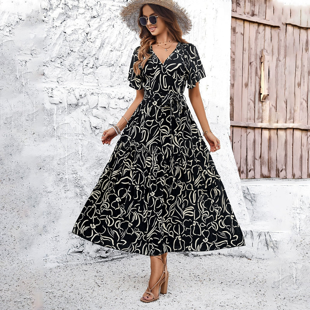 Women's wrap dress with voluminous sleeves and playful pattern, size S