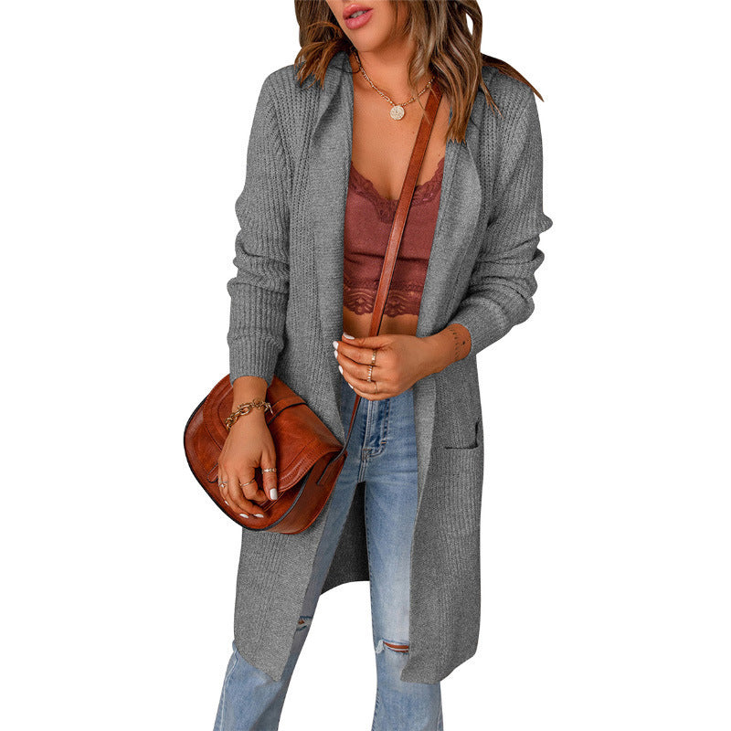 Women's knitted coat with deep V-neck and generous pockets, size