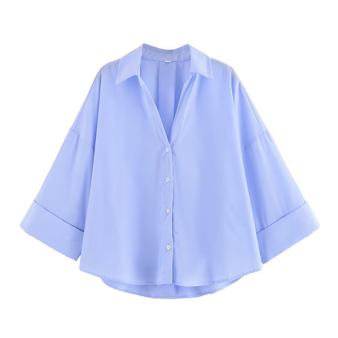 Women's blouse with oversized cut and chic lapel, size