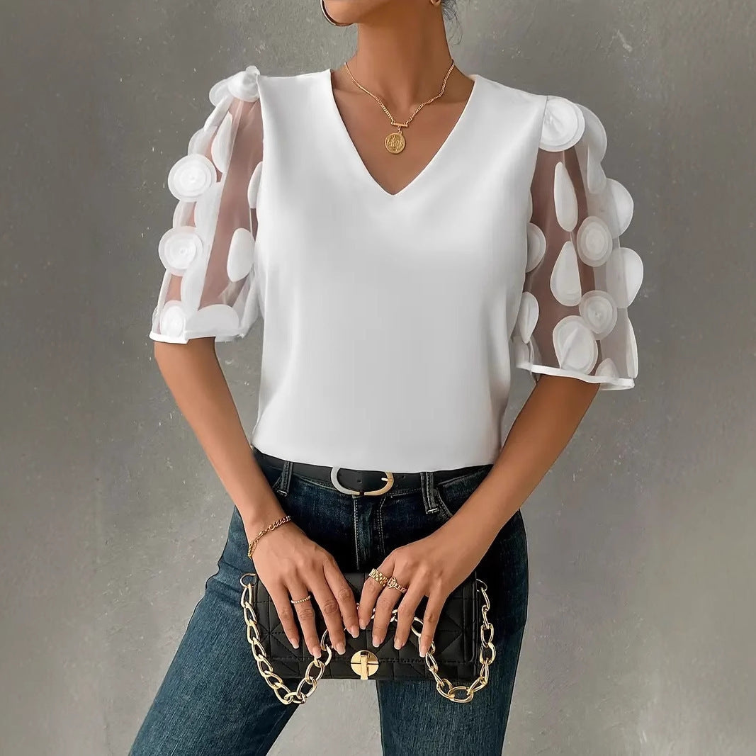 Women's blouse with sheer puff sleeves and elegant details, size S