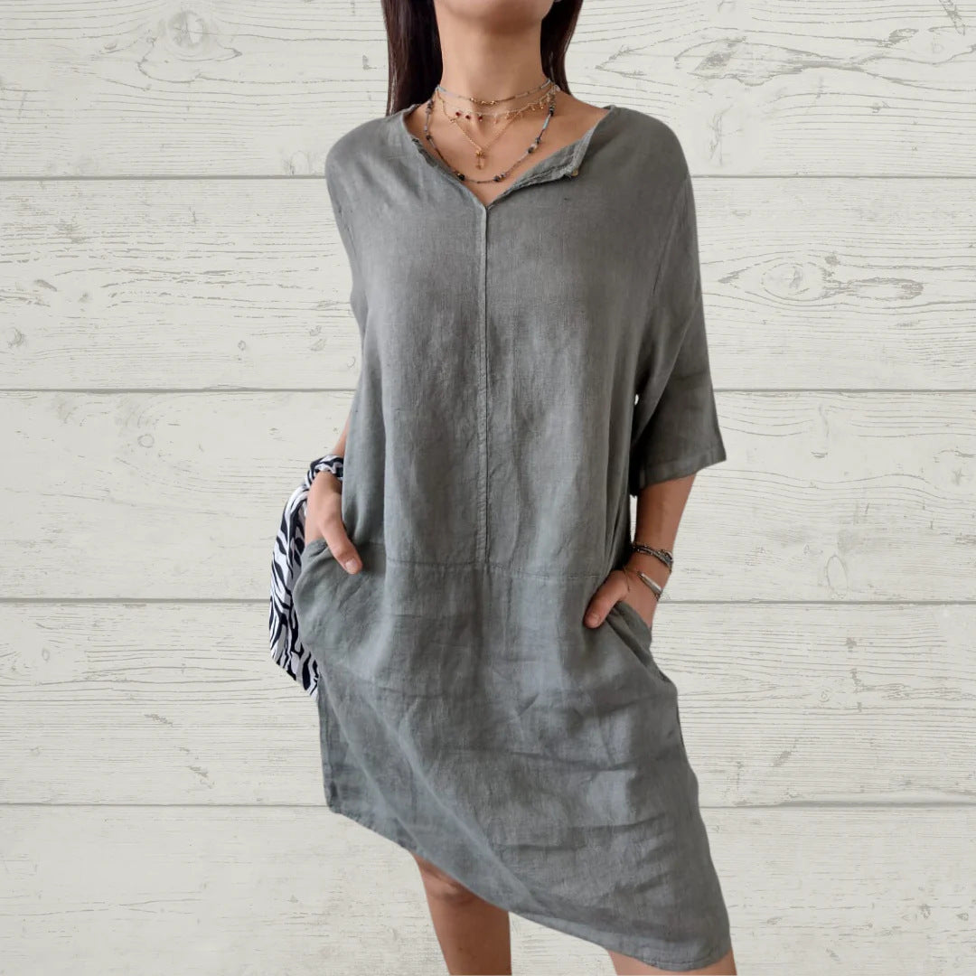 Women's lightweight linen dress with front button detail and side pockets, size