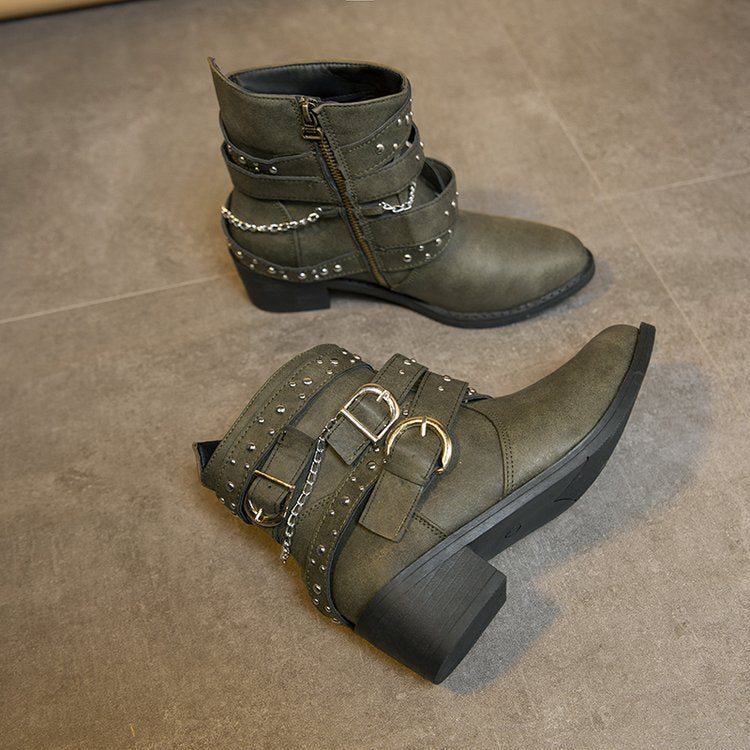 Women's ankle boots with a fashionable strap design and decorative accents, size S