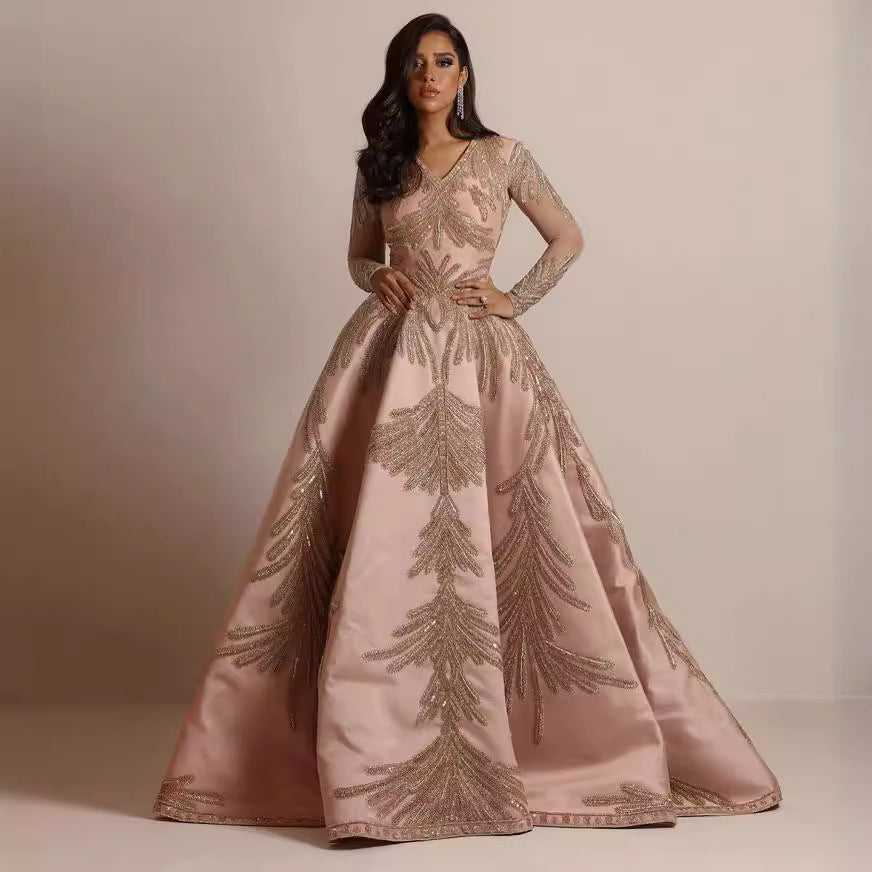 Women's glamorous ball gown with delicate sequin embellishment and long cut, size S