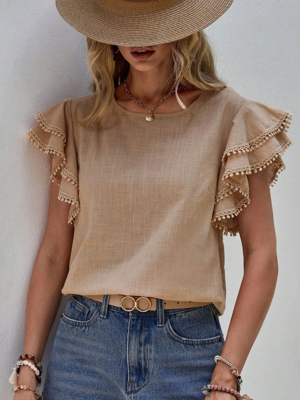 Women's lightweight top with playful ruffles and decorative hem, size [size]
