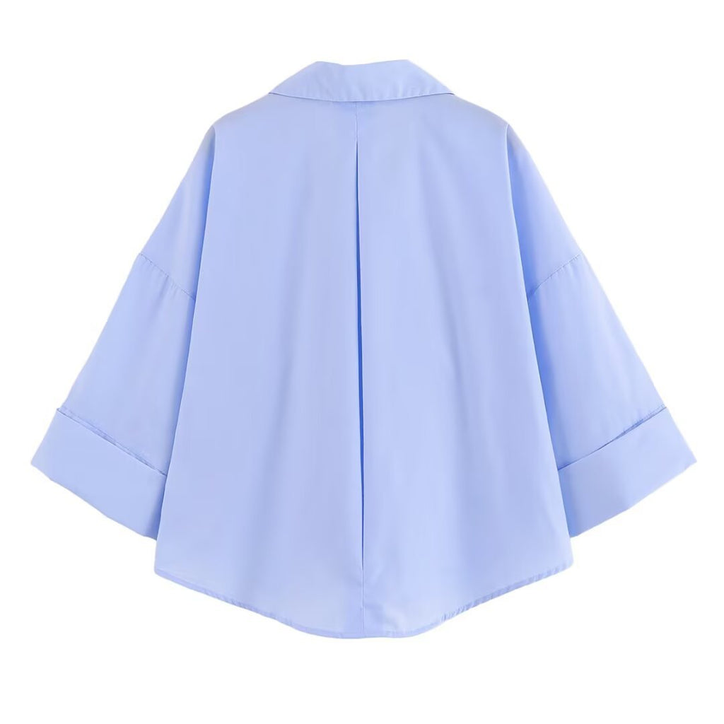 Women's blouse with oversized cut and chic lapel, size